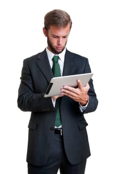 Young businessman with tablet isolated in white