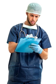 Young doctor in uniform writing in a pad