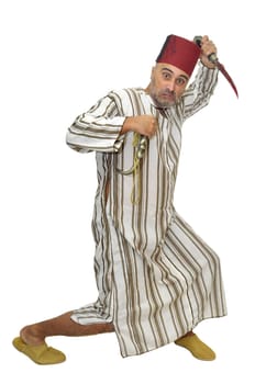 Arabic man with a dagger making funny faces isolated in white