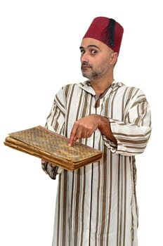 Arabic man with very old book isolated in white