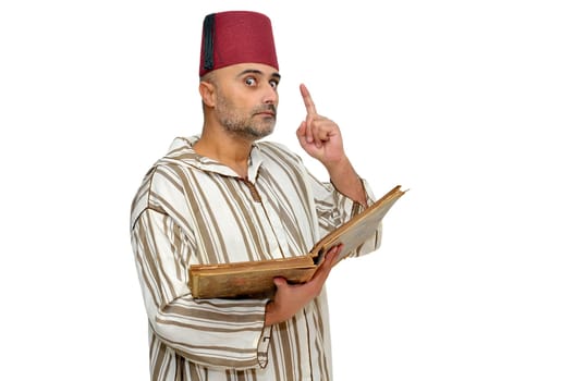 Arabic man with very old book isolated in white