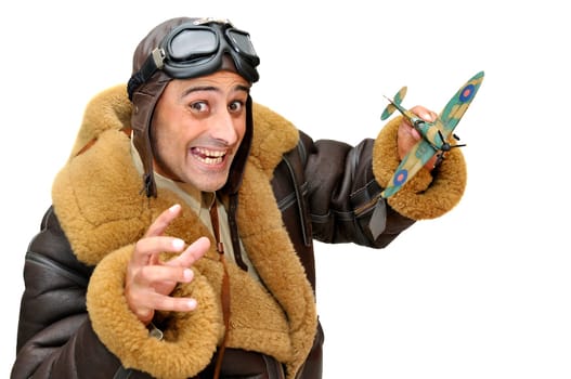 Fighter pilot with model plane isolated in white