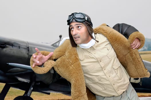 WWII fighter pilot running to his plane