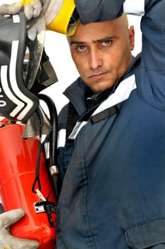 Fireman in uniform isolated in white