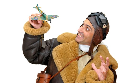 Fighter pilot with model plane isolated in white