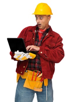 Confused construction worker with laptop isolated in white