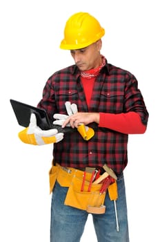 Construction worker with laptop isolated in white