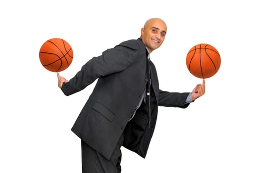 Businessman with several basketballs isolated in white