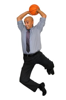Businessman jumping with basketball for a dunk isolated in white