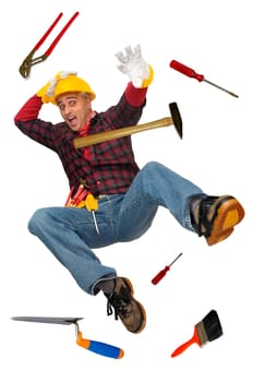 Construction worker falling with tools isolated in white