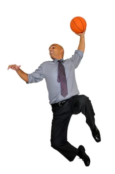 Businessman jumping with basketball for a dunk isolated in white