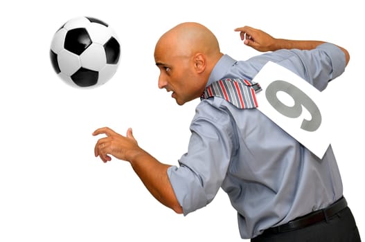 Businessman playing with a soccer ball isolated in white