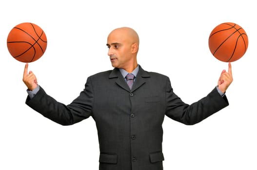 Businessman with several basketballs isolated in white
