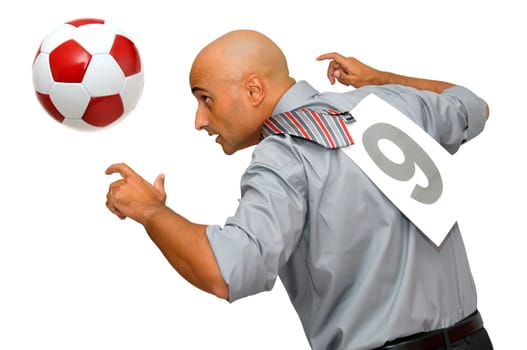 Businessman playing with a soccer ball isolated in white