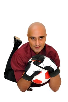 Businessman goalkeeper with gloves and ball in a acrobatic save isolated in white
