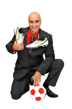 Businessman with soccer ball isolated in white
