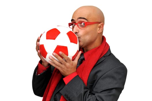 Businessman kissing a soccer ball isolated in white