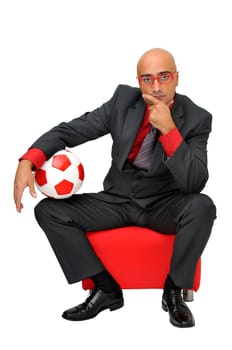 Businessman with soccer ball isolated in white
