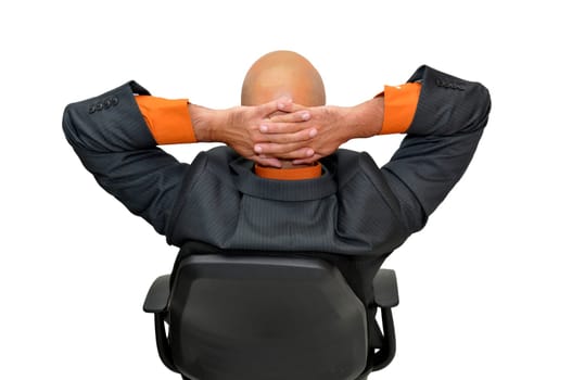 Mature businessman in a chair isolated in white