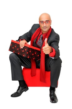 Businessman with gift isolated against a white background