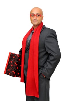 Businessman with gift isolated against a white background