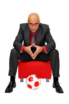 Businessman with a soccer ball isolated in white