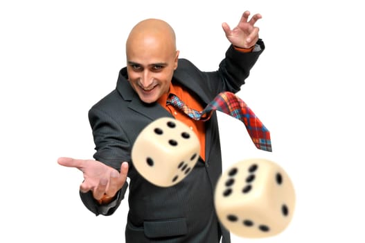 Man in a suit playing dice isolated in white