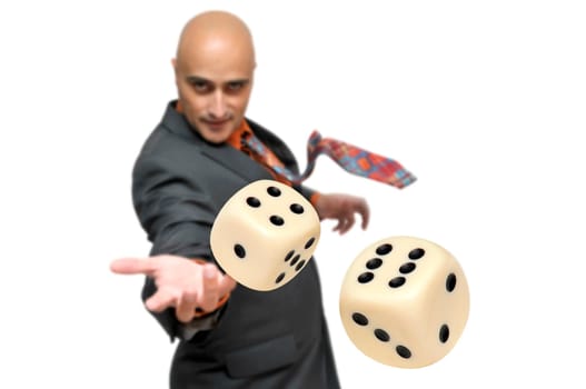 Man in a suit playing dice isolated in white