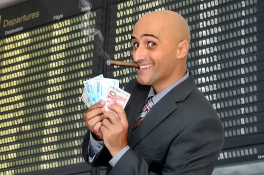 Businessman with money and a cigar