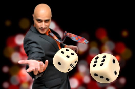 Man in a suit playing dice