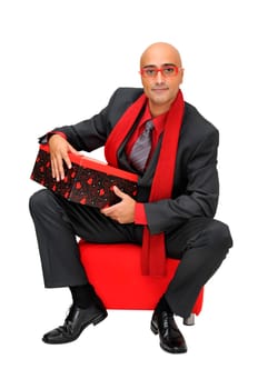 Businessman with gift isolated against a white background