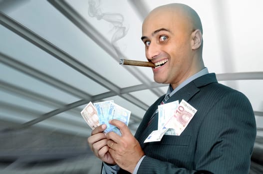 Businessman with money and a cigar