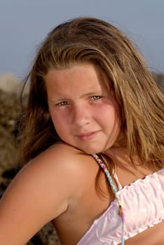 Beautiful young girl posing in the beach