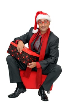 Businessman with gift isolated against a white background