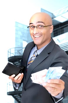 Happy businessman with money