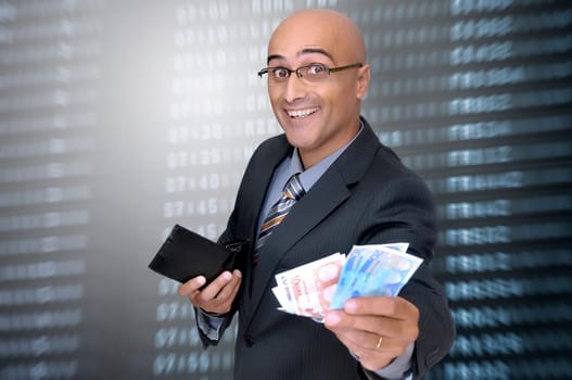 Happy businessman with money