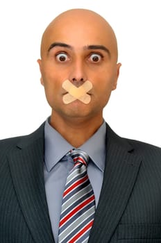 Distressed businessman with band aid in his mouth isolated in white
