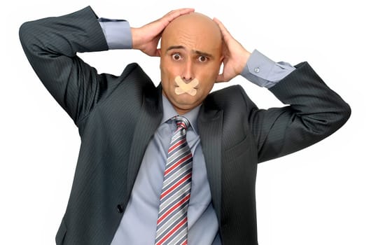 Distressed businessman with band aid in his mouth isolated in white