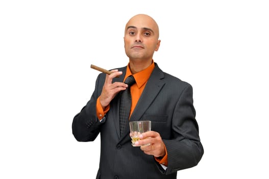 Businessman with drink and cigar isolated against a white background