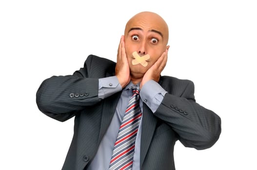 Distressed businessman with band aid in his mouth isolated in white