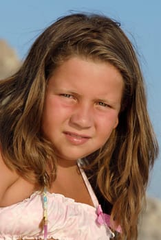 Beautiful young girl posing in the beach