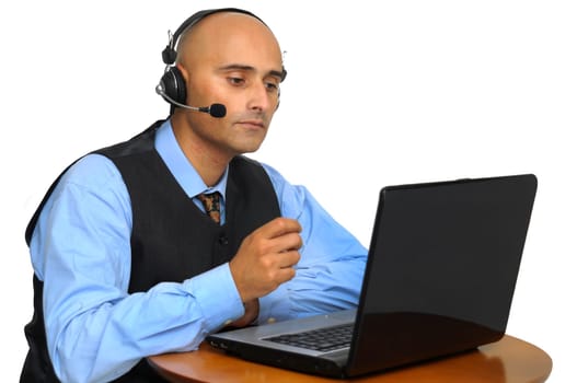 Businessman with headset and laptop isolated in white