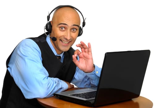 Businessman with headset and laptop isolated in white