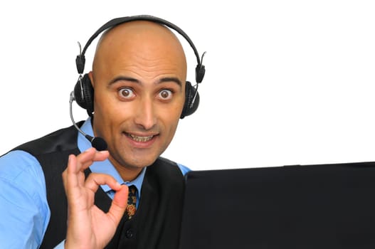 Businessman with headset and laptop isolated in white