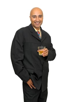 Businessman with a glass of whiskey isolated in white