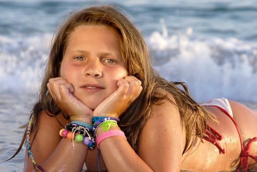 Beautiful young girl posing in the beach