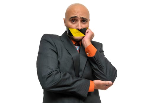 Businessman portrait with duct tape in is mouth