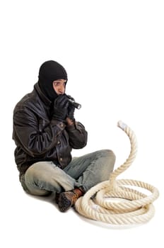 Burglar wiht flashlight and rope isolated in white