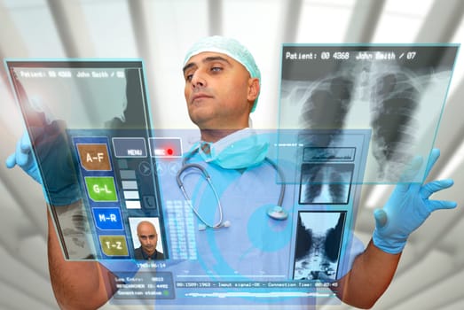 Doctor with hightech computer screen viewing patient data