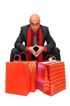Businessman with shopping bags isolated in white